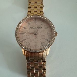 Rose gold women’s Michael Kors watch